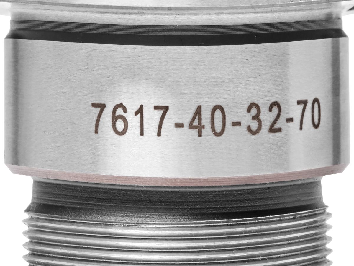 Laser-etched part number on a machined stainless steel fitting
