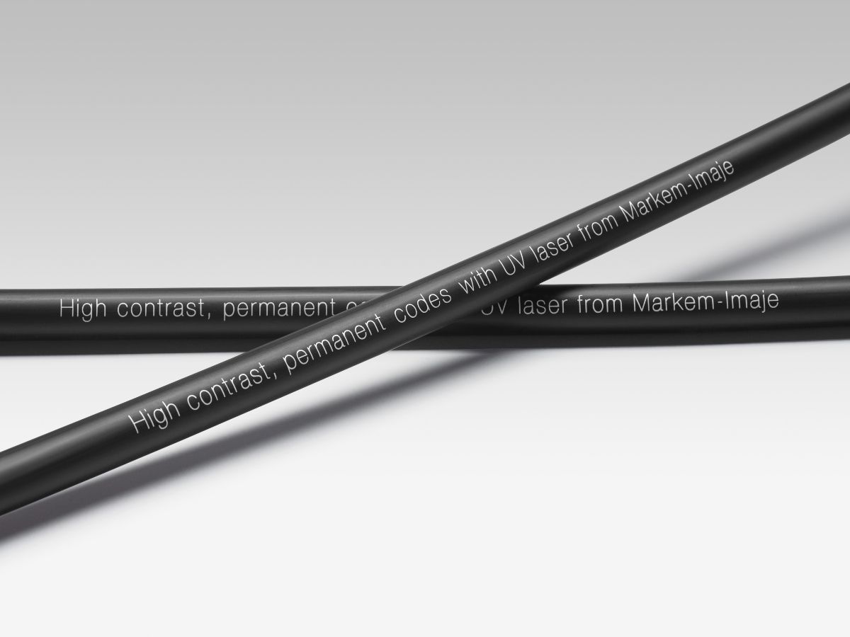 High-contrast white UV laser text on black cable and wire